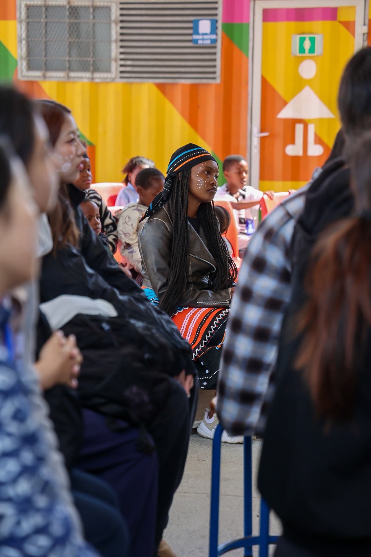 A young community member listening at the gathering