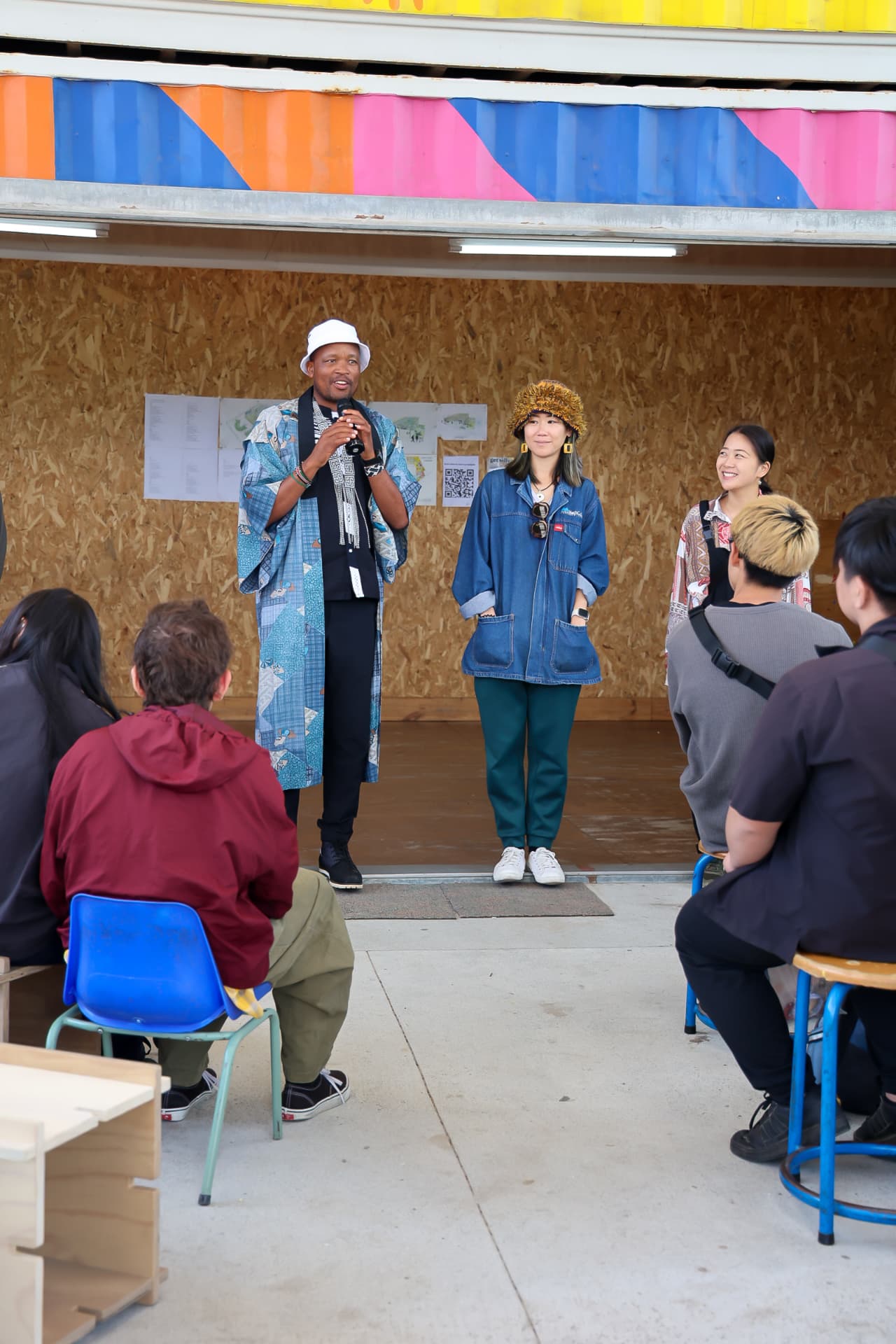Speakers smiling together at a community gathering